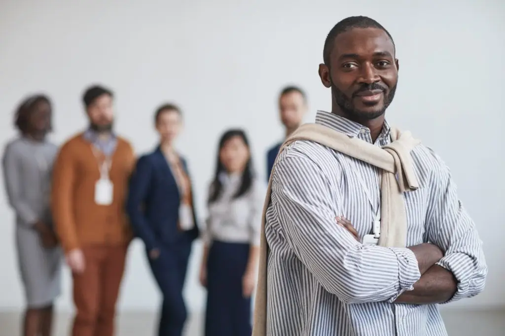 african american leader with business team