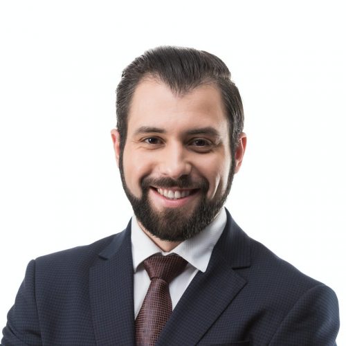 cheerful bearded businessman in suit with crossed arms isolated on white e1627749098330